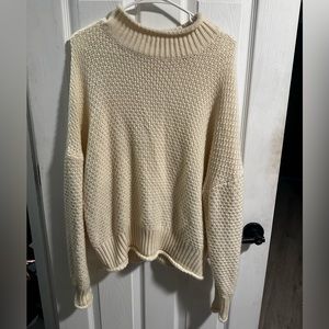 Relaxed turtle neck knit cream sweater